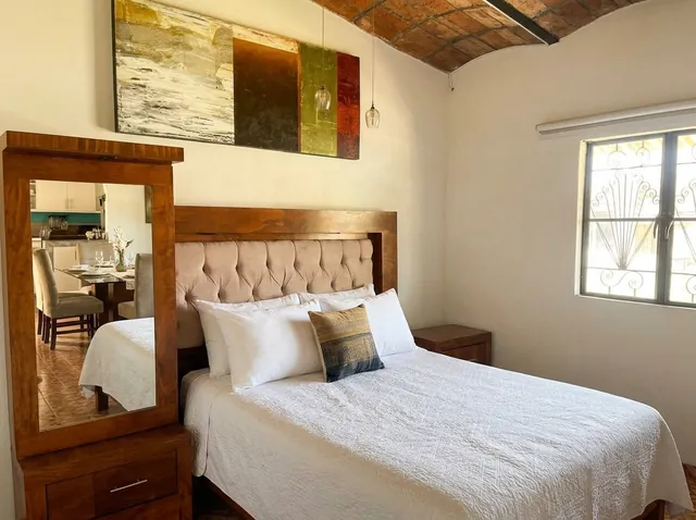 Main bedroom with upholstered headboard