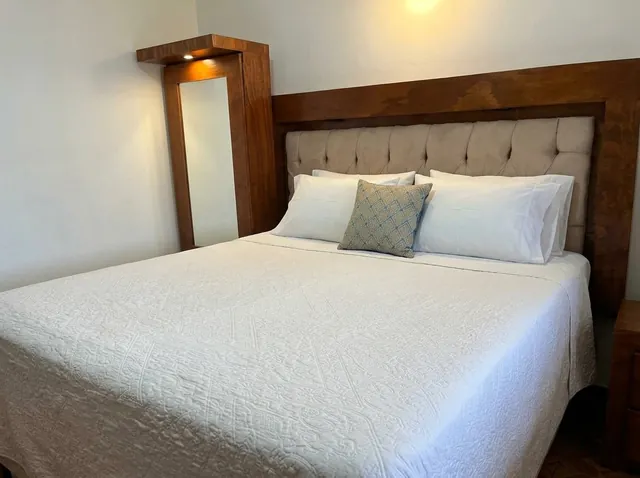 Bed with wooden headboard